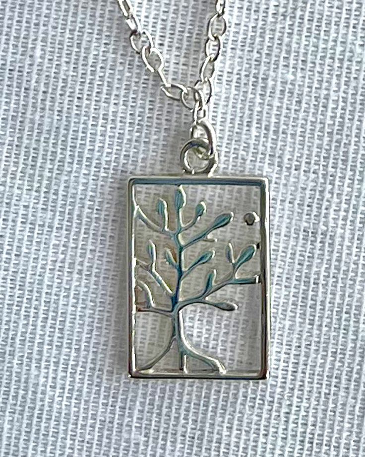 Tree of Life Necklace - Sterling silver Tree of Life charm - Sterling silver chain (16 inches) - Sterling silver lobster claw clasp Delicate charm with detailed tree of life swinging from a delicate silver chain. Your unique piece is designed and created by hand in my Tucson studio * Custom orders welcome!  Please contact me through Etsy The Tree of Life represents the afterlife, and the connection between the earth and heaven. Spiritual Tree Of Life Sterling Silver Necklace, Symbolic Silver Necklace With Tree Of Life, The Afterlife, The Tree Of Life, Tree Necklace, Silver Tree, Tree Of Life Necklace, Sterling Silver Chain, Tucson