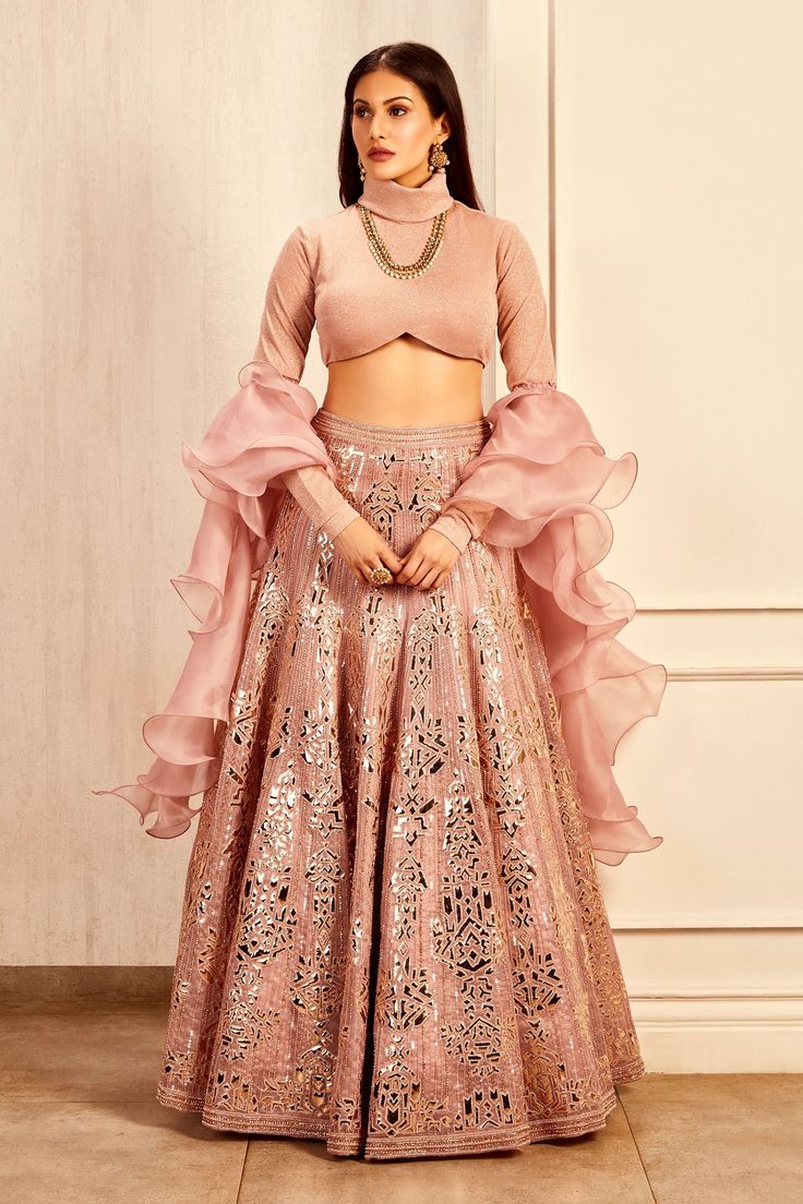 Pink lehenga in organza base with foil and hand embroidery. Paired with turtle neck blouse and ruffled dupatta.
Components:3
Pattern:Embroidered
Type of Work:Foil
Neckline:Turtle Neck
Sleeve Length:Full
Fabric:Organza
Color:Pink
Other Details:
Inverted V-hem blouse
Ruffle dupatta
Note: The neckpiece worn by the model is not for sale
Occasion:Destination Wedding - Aza Fashions Winter Lehenga, Green Bridal Lehenga, Turtle Neck Blouse, Turtle Neck Collar, Indian Bridesmaid Dresses, Reception Bride, Bridal Trends, Bridal Lehenga Red, Pink Lehenga