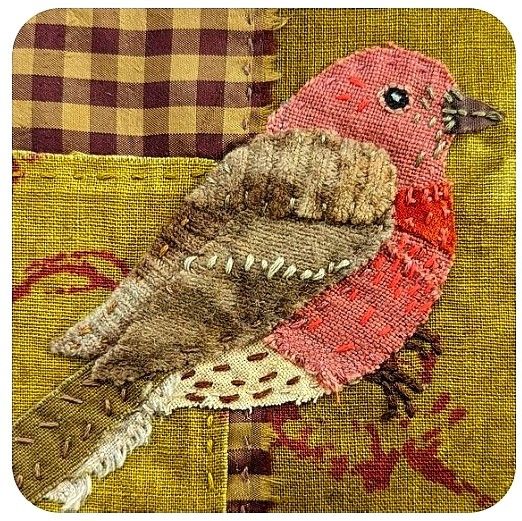 a close up of a bird on a piece of fabric