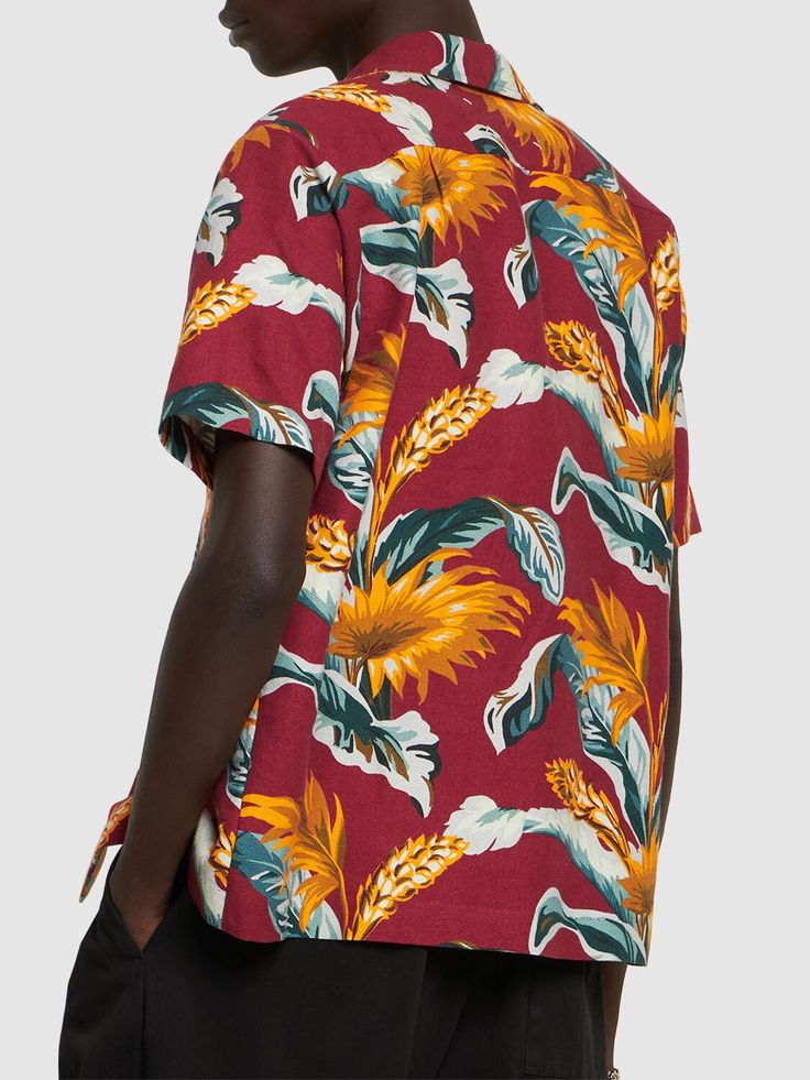 Front button closure. All over print placement may vary. Model is wearing a size48