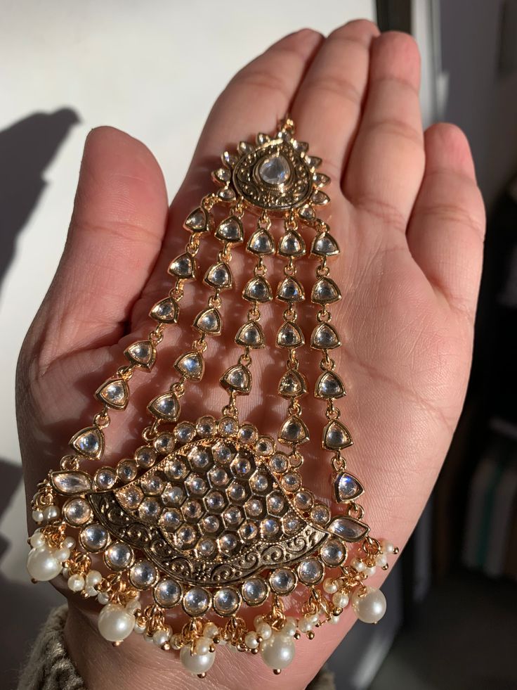 Traditional chic jhoomar pasa head jewelry featuring 22k gold plated finish, pearls and kundan stones. Imported. Measures 5 inches long. Gold Bollywood Dupatta With Intricate Design, Heavy Elegant Gold Dupatta, Gold Dupatta With Intricate Design For Festivals, Gold Meenakari Dupatta For Reception, Traditional Gold Dupatta With Stone Work, Gold Dupatta With Stone Work For Festivals, Traditional Chic, Culture Day, Credit Card Online