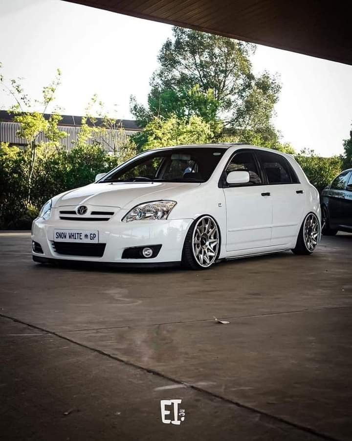 a white car parked in a parking lot