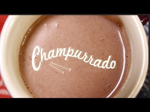 a close up of a cup of coffee with the word chappurado written on it