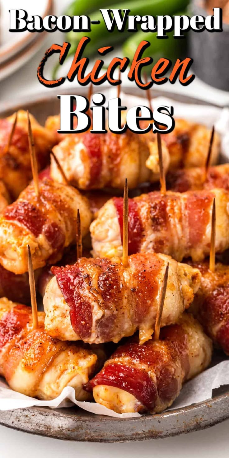 bacon chicken bites on a platter with toothpicks in the middle and green beans in the background