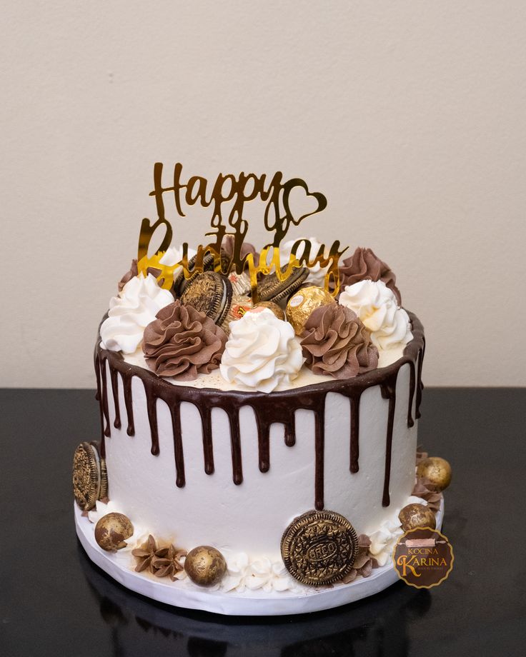 a birthday cake with chocolate and white frosting