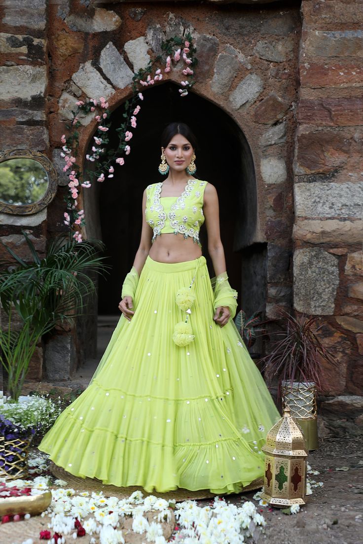 Featuring here neon green flared Lehenga Set with mirror, bead, zari work paired with net dupatta & mirror work blouse Fabric - Silk, Georgette, net Components - 3 Colour - Neon Green Embroidery details - Hand Embroidery Delivery time - 2-3 weeks Washing Instructions - Dry-clean Pista Green Sets For Reception Navratri, Pista Green Sets For Reception And Navratri, Pista Green Sets For Reception During Navratri, Pista Green Cutdana Party Choli, Navratri Pista Green Set With Mirror Work, Party Net Choli With Cutdana Details, Party Net Choli With Cutdana, Fitted Net Choli With Cutdana, Pista Green Palazzo Set With Mirror Work For Reception