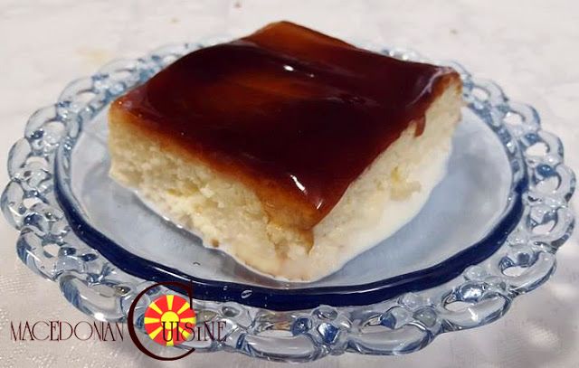 a piece of cake sitting on top of a glass plate covered in caramel icing