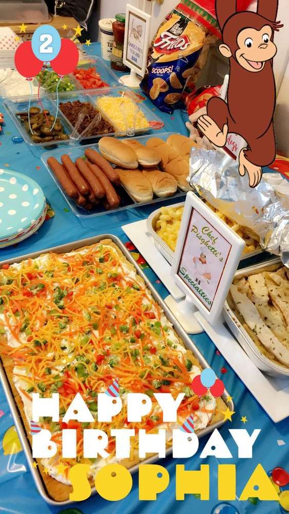 an image of a birthday party with food on the table