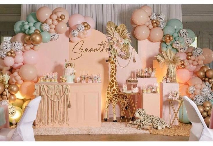 a giraffe themed party with balloons and decorations