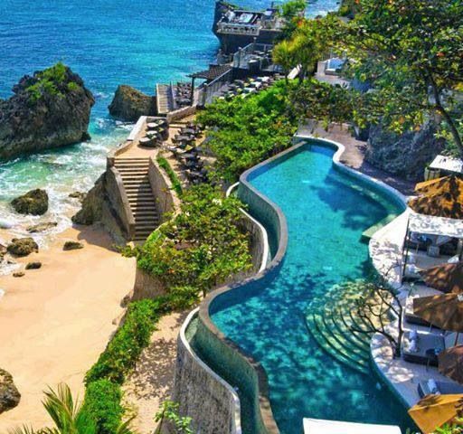 an aerial view of the beach and pool