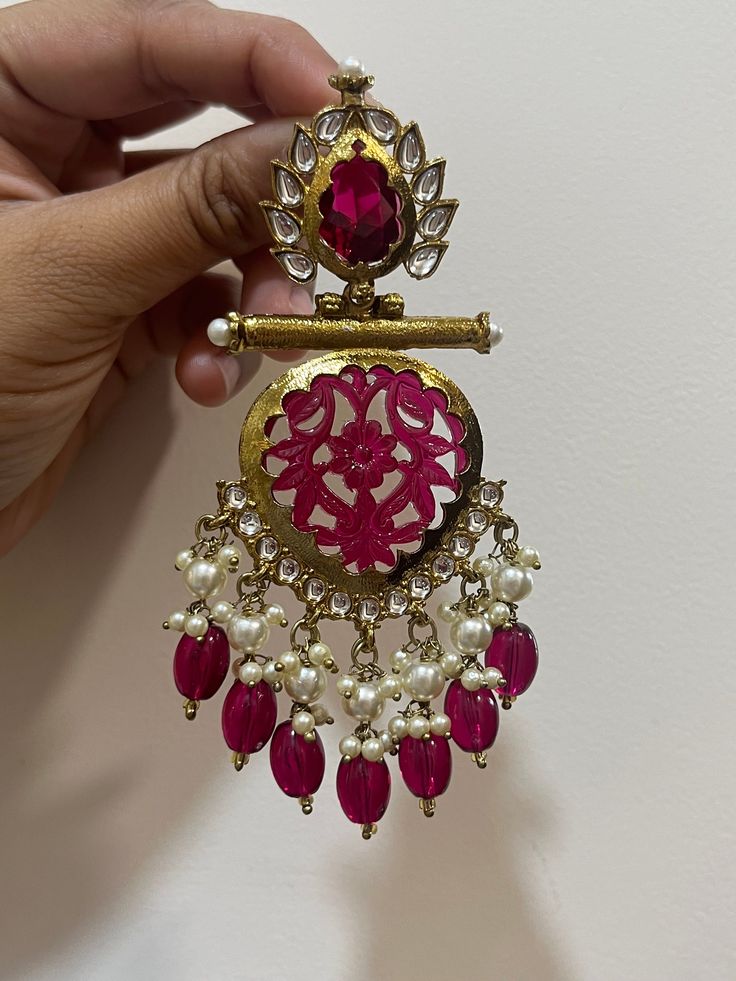 Beautiful dangler earrings with Kundan gold detailing available in  stunning Pink color ! They add elegance to every outfit! Festive Temple Jewelry Earrings For Celebrations, Traditional Gold Plated Danglers For Celebrations, Elegant Kundan Jhumkas With Gota Work, Traditional Gold Chandelier Earrings With Cutdana, Traditional Gold Plated Danglers For Diwali, Wedding Chandbalis With Matching Earrings For Navratri, Elegant Kundan Bridal Earrings With Cutdana, Elegant Bridal Earrings With Kundan And Cutdana, Traditional Gold Plated Bridal Earrings For Celebration