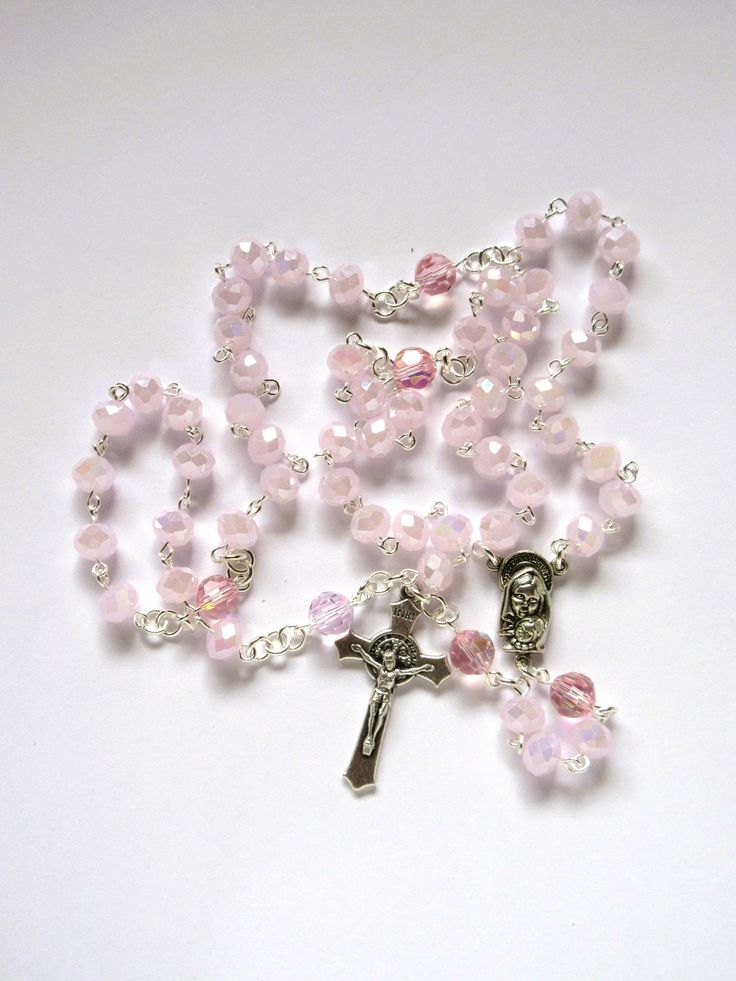 This Catholic rosary is made with AB pink faceted 8x6mm rondelles. The beads have a high luster. The Pater beads are 8mm crystals. The crucifix is Italian made oxidized silver. I hand turned the silver plated wires. The connector is Mother and Child with the Sacred Heart on the reverse side. This rosary measures about 29 inches around and has a 5 inch cross drop. It will be slipped into a velvet bag and shipped in a bublble mailer. Pink Rosary, Catholic Decor, Mushroom Jewelry, The Sacred Heart, Catholic Rosary, Rosary Catholic, Pink Girly Things, Rosary Beads, Fancy Jewelry