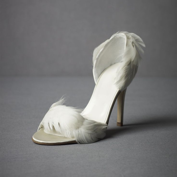 Step into elegance with our Ivory Satin Wedding Shoes. These stunning stiletto heel sandals feature delicate feather embellishments, adding a touch of glamour to your special day. Crafted from luxurious satin, these sandals offer both style and sophistication for your wedding ensemble. Color: Ivory Material: Satin Heel Type: Stiletto heel Heel Height: 4.72" / 120 mm approx Product measurements were taken using size 8. Please note that measurements may vary by size. Toe: Open toe Faux feather emb Bridal Sandals Heels, Stiletto Heels Sandals, White Heels Wedding, Feather Shoes, Satin Wedding Shoes, Feather Heels, Pencil Heels, Ballerina Heels, Heels Outfits