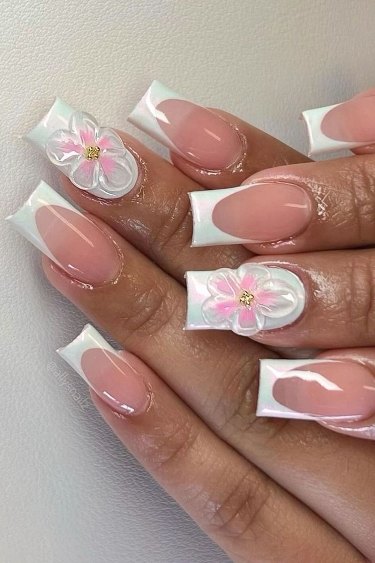 a woman's hand with french manies and pink flowers on the tip of their nails