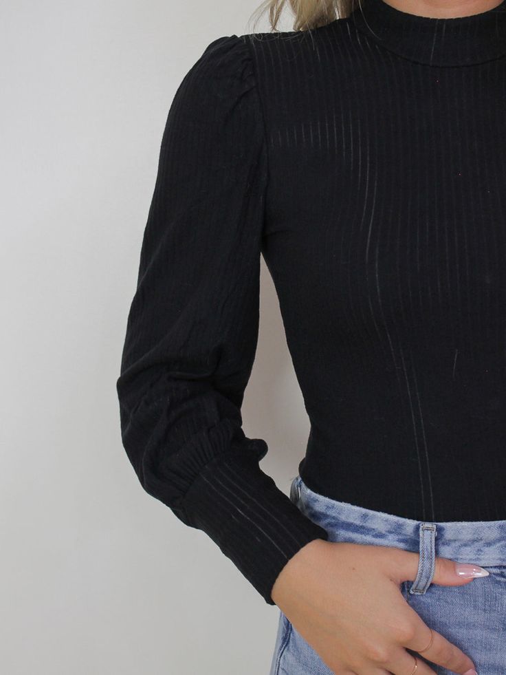 Black, long sleeve top with gold button details along the back Ribbed, knit, soft fabric Mock neck neckline Bishop style sleeves BUST WAIST LENGTH SMALL 30" 24.5" 20.5" MEDIUM 31" 26" 21" LARGE 32" 27.5" 21.5" MATERIAL/CARE: 95% Rayon . 5% Spandex Hand wash / lay flat to dry Long Sleeve Knit Top, Jewel Necklace, Candles For Sale, Black Long Sleeve Top, Long Sleeve Knit Tops, Earring Sale, Waist Length, Gold Buttons, Long Sleeve Knit