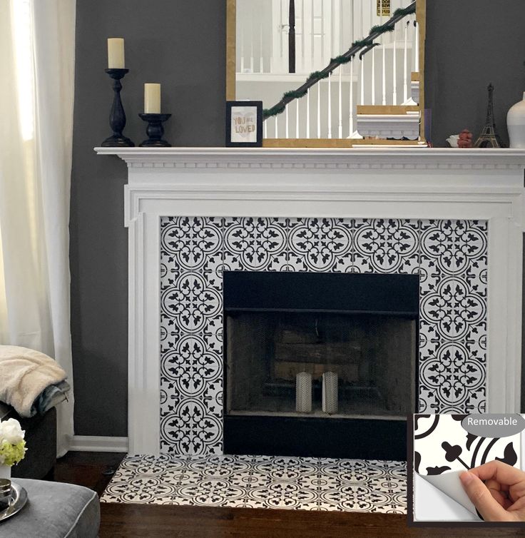 the fireplace is decorated with black and white tiles