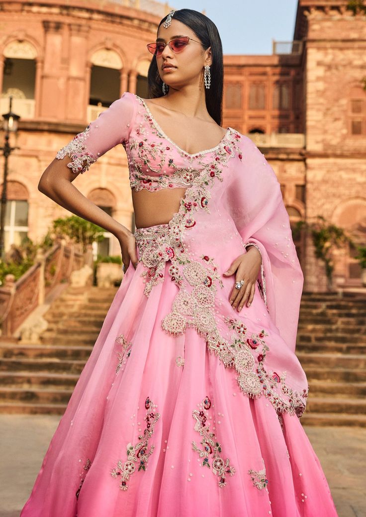 Pink lehenga set with thread work and pearl embroidery. Organza Choli With Mirror Work, Organza Palazzo Set With Dori Work For Navratri, Navratri Organza Palazzo Set With Dori Work, Traditional Organza Palazzo Set With Dori Work, Organza Palazzo Set For Wedding And Navratri, Traditional Organza Sets For Reception, Traditional Organza Reception Sets, Dola Silk Lehenga For Wedding, Reception Gown In Dola Silk