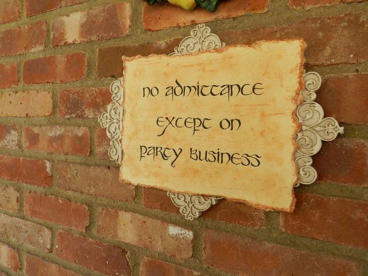 a brick wall with a sign on it that says no admittance except on party business