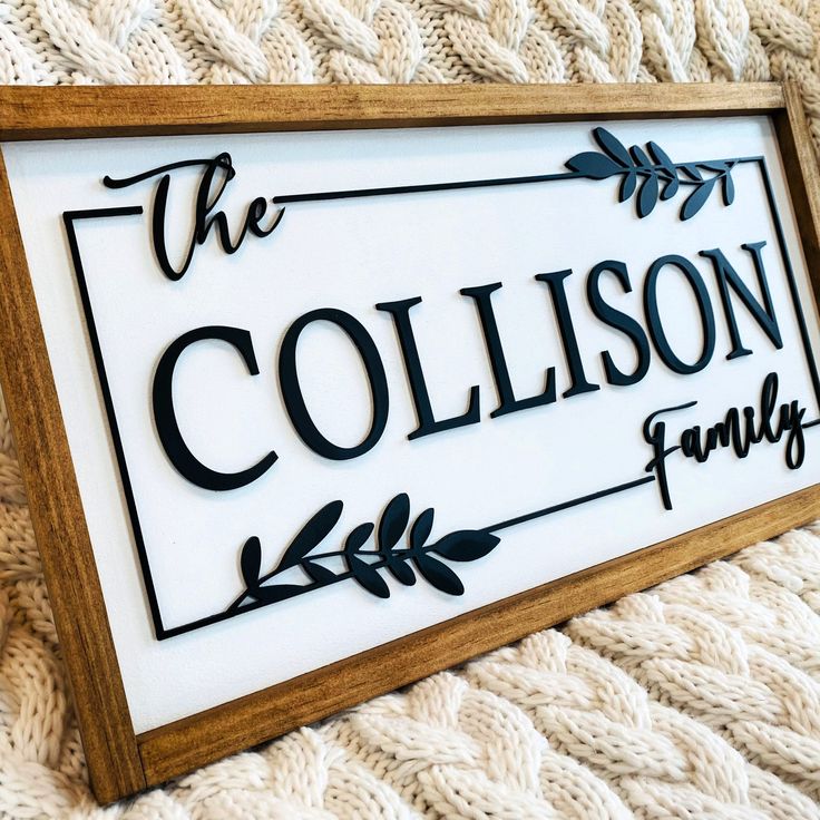 a sign that says the collison family is on top of a white blanket