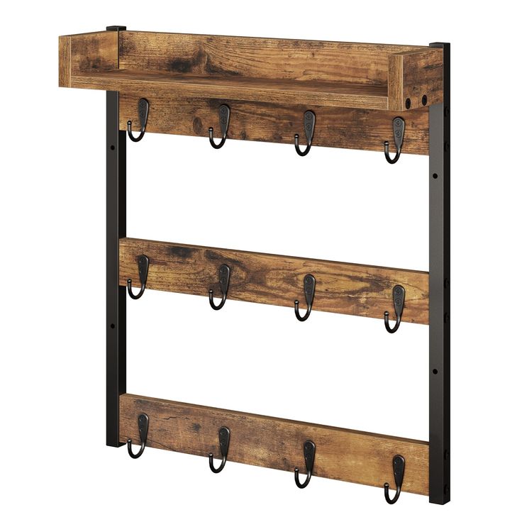 a wooden shelf with metal hooks on it