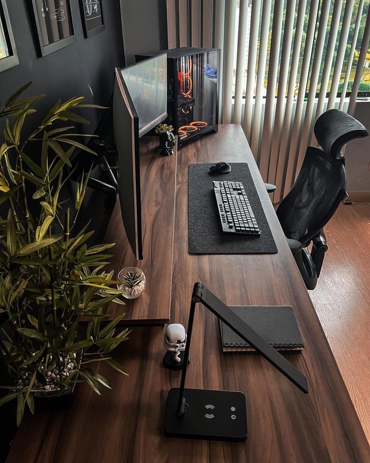 a desk with a keyboard, mouse and monitor on it