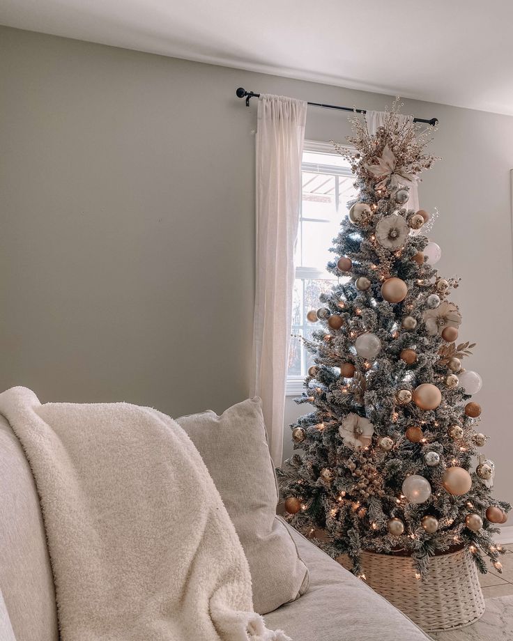 a living room with a christmas tree in the corner