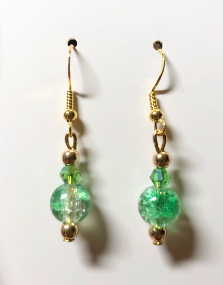 Gold plated findings. green beads. hypoallergenic materials. Lightweight. Nickel-free Green Earrings For Party, Green Nickel-free Party Earrings, Nickel-free Green Beaded Earrings For Parties, Elegant Green Nickel-free Clip-on Earrings, Green Beaded Dangle Teardrop Earrings, Green Beaded Teardrop Jewelry, Green Teardrop Beaded Earrings For Party, Green Round Earrings For May Birthstone, Green Earrings For May Birthstone