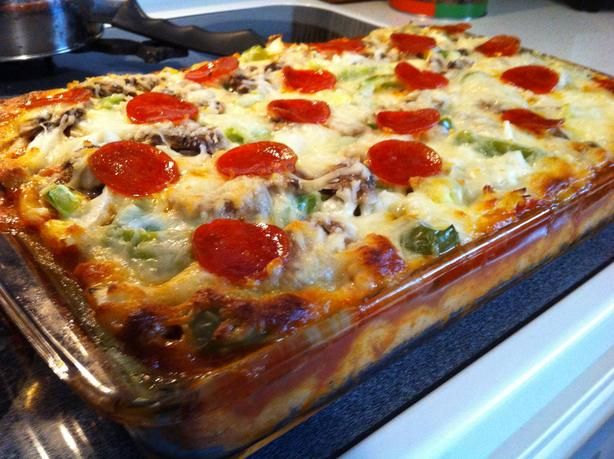 a pizza casserole sitting on top of a stove