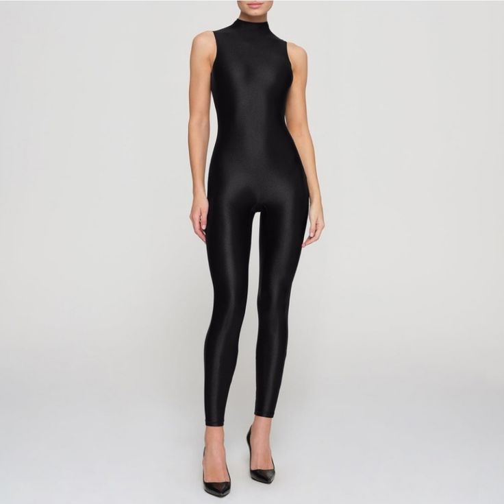 Nwt, Skims Shine Jersey Mockneck Sleeveless Catsuit/Bodysuit In Onyx. Sold Out At Skims! The Perfect Full-Length Catsuit To Show Off Your Figure With Curve Hugging Fit And Glossy Statement-Making Look. Features A Mock Neckline And Zipper At Center Back. Fits True To Size. Machine Wash Cold- Lay Flat To Dry Sleek High Stretch Black Unitard, Black High-neck High-stretch Jumpsuit, Black High Neck Jumpsuit With High Stretch, Sleek High-stretch Black Unitard, Black High-stretch High Neck Jumpsuit, High Stretch Black High Neck Jumpsuit, Sleeveless Second-skin Elastane Unitard, Sleek Sleeveless High-stretch Jumpsuits And Rompers, Sleeveless Bodysuit For Evening