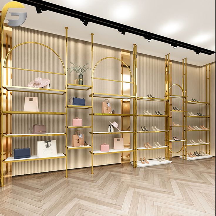 the interior of a shoe store with gold shelves