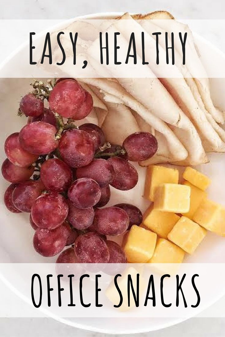 the words easy, healthy office snacks on a white plate with grapes and sliced chicken