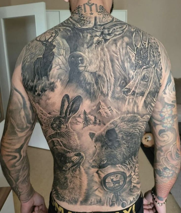 a man with tattoos on his back and chest