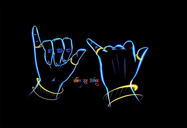 two hands are shown with neon lights in the dark