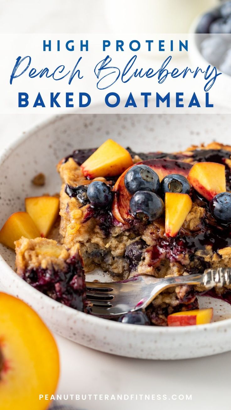 a close up of a plate of food with blueberries and peaches on it