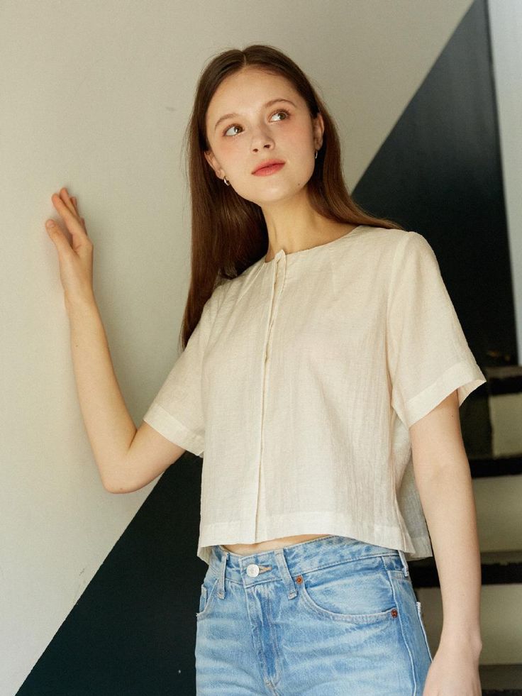 This is a trendy and feminine top by LAMARO that is made out of high quality and sturdy material. With distinctive mood of the design and comfortable wear, you can style it for your casual daily outfit.- Light fabric with high air permeability- Clean look with hidden buttons- Casual and feminine mood Modern Cropped Top For Everyday Wear, Modern Short Sleeve Tops For Casual Gatherings, Versatile Cropped Linen Tops, Chic Cropped Tops With Relaxed Fit, Chic Cropped Relaxed Fit Tops, Beige Versatile Blouse With Relaxed Fit, Everyday Cropped Linen Top, Versatile Beige Short Sleeve Blouse, Versatile Beige Cotton Tops