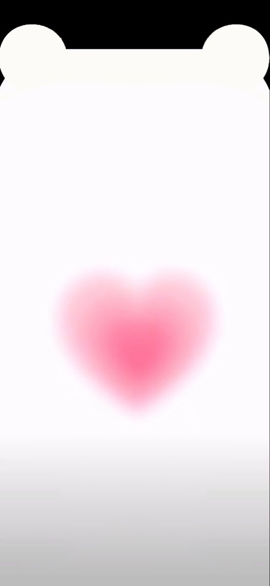 a heart shaped object is shown in the middle of a white paper with pink ink on it