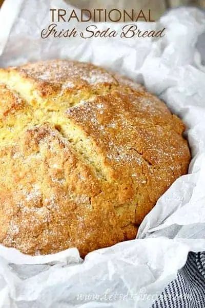 a loaf of fresh soda bread in a basket