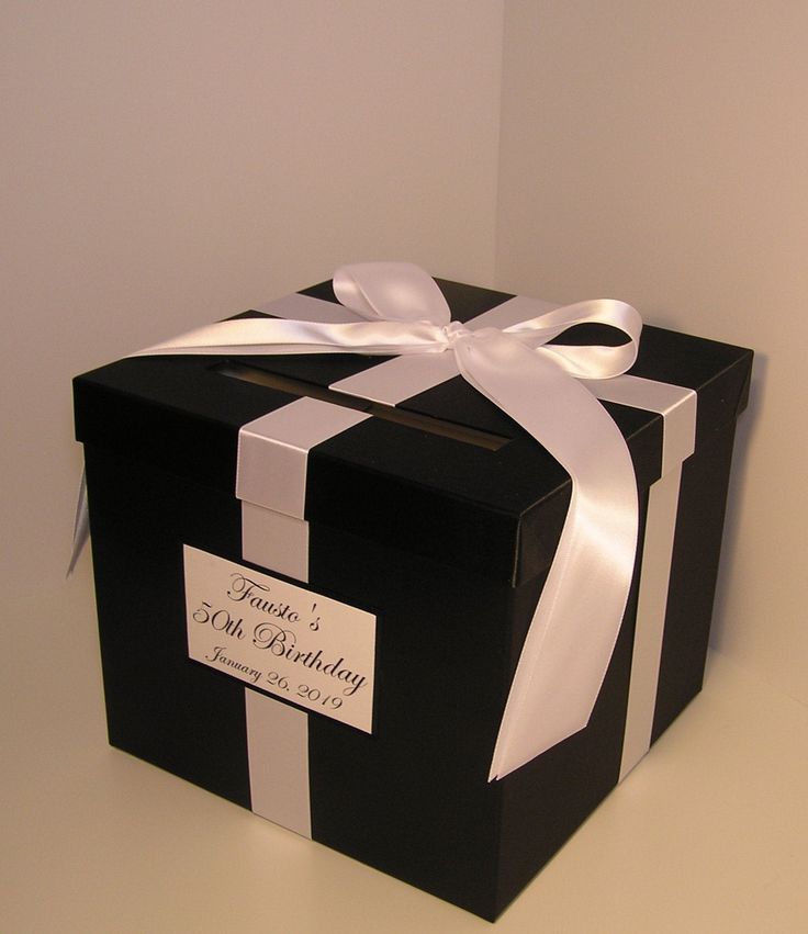 a black and white box with a ribbon on it