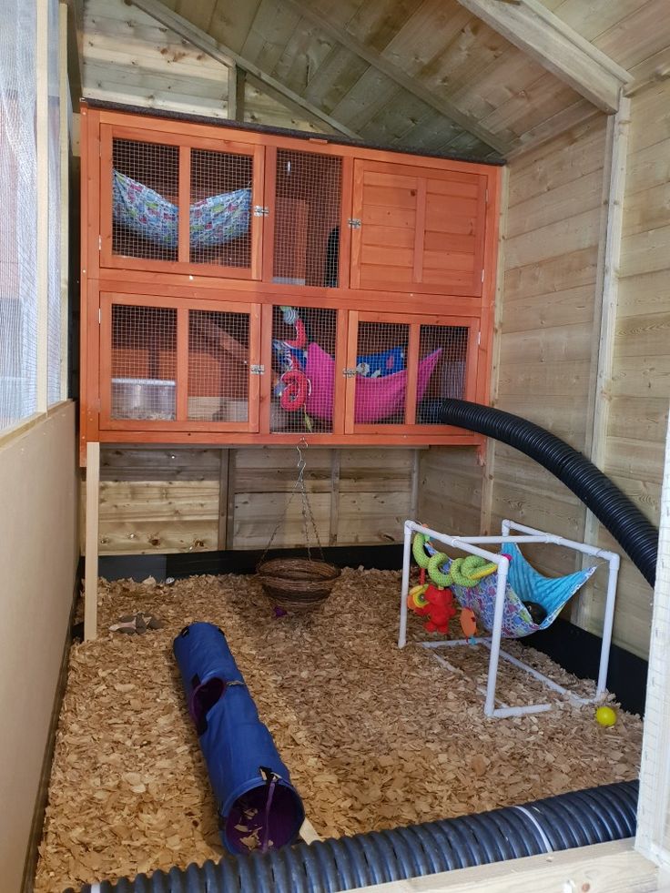 the inside of a chicken coop filled with lots of hay and other things to put in it