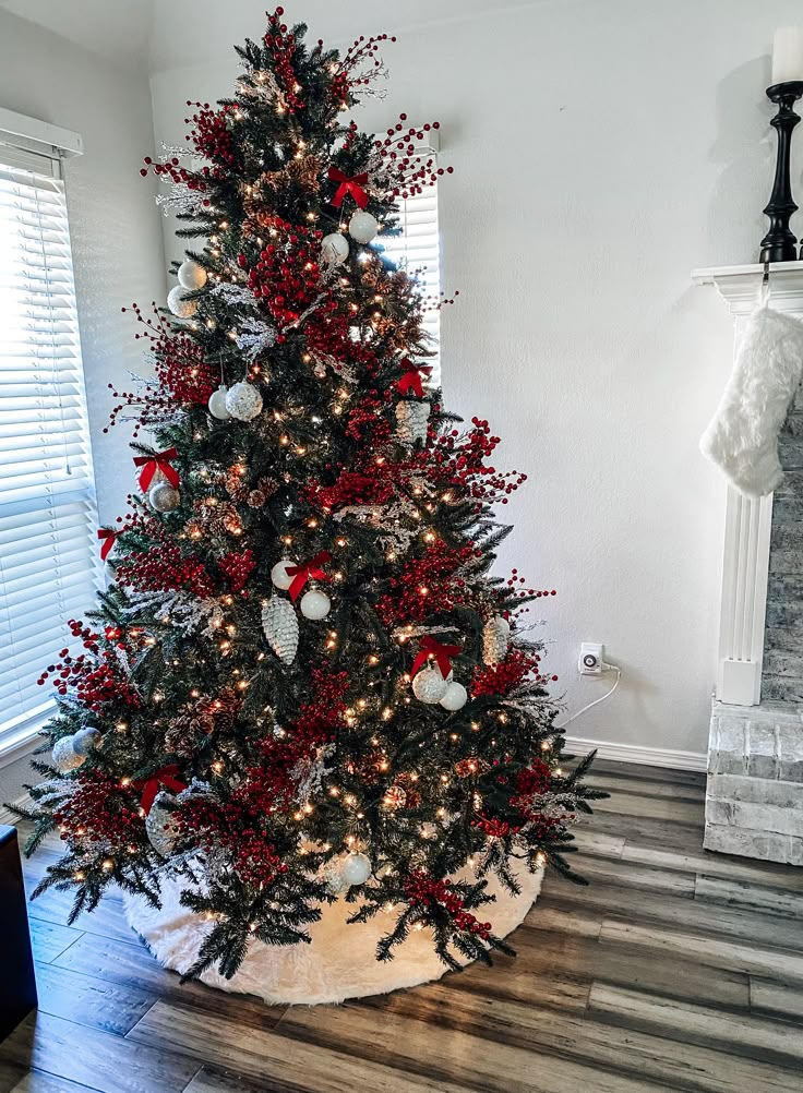 a decorated christmas tree with red and white ornaments