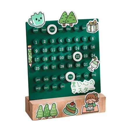 a green wooden calendar with stickers on it