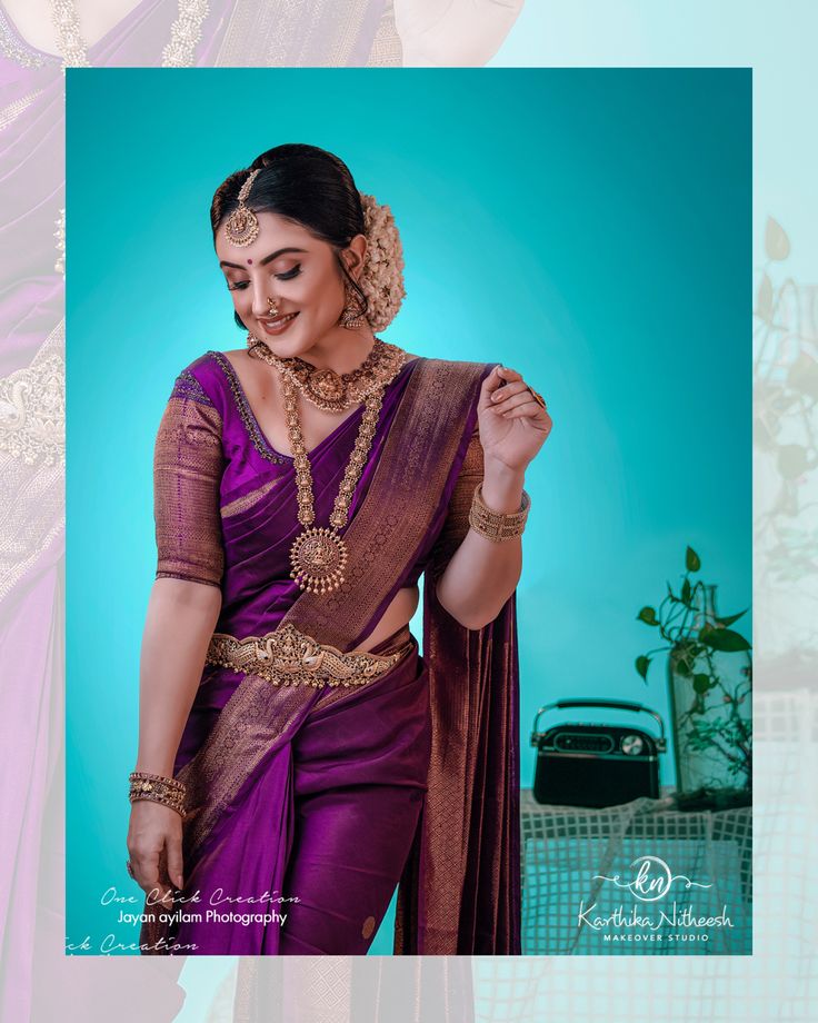 a woman in a purple sari with gold jewelry on her neck and hands behind her back