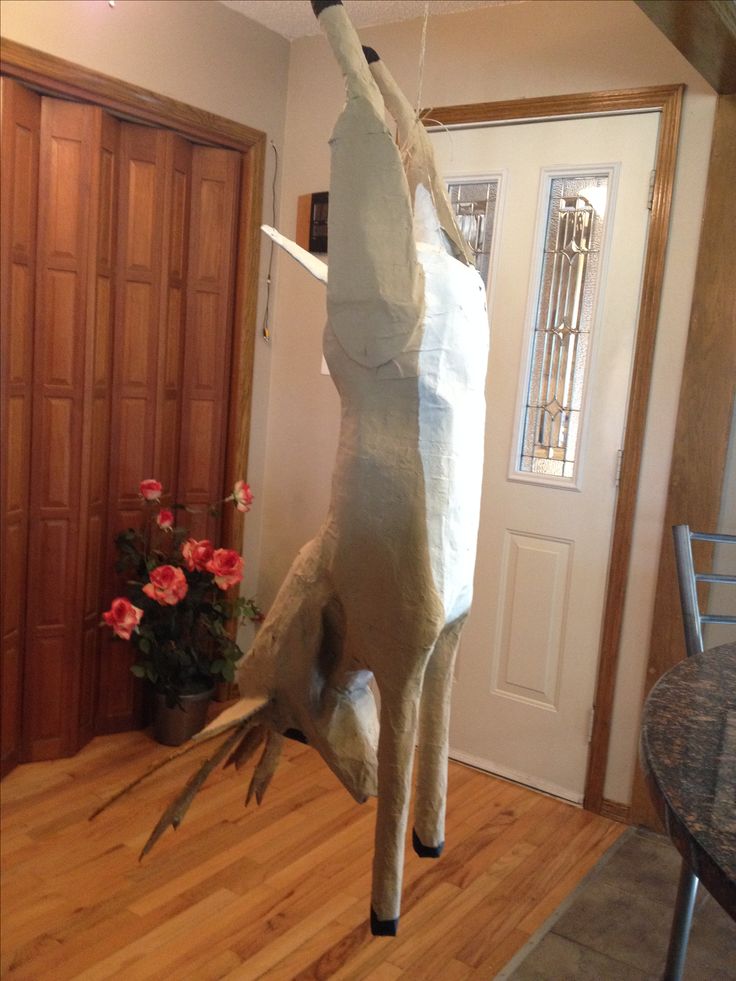 an animal made out of paper is standing on its hind legs