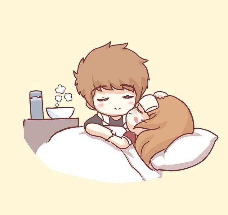 a boy laying in bed with a cat on his back and holding him up to the pillow