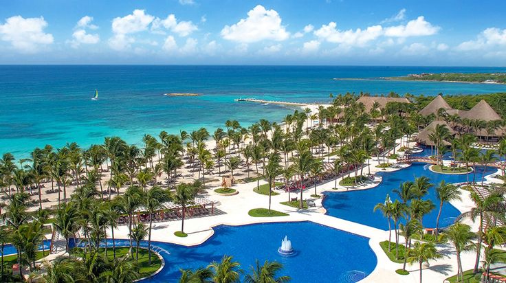 an aerial view of the beach and pool area at dreamscape cancuce resort