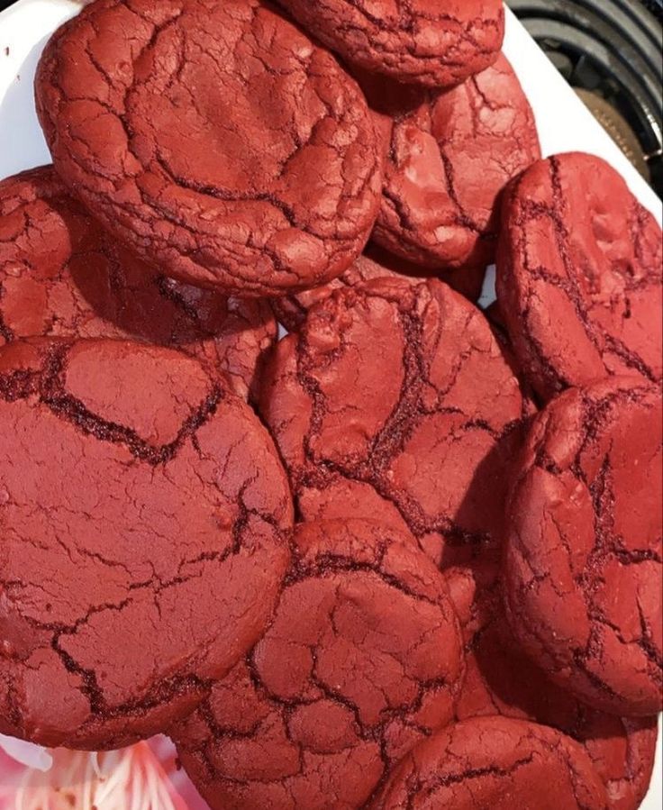 red cookies are piled on top of each other