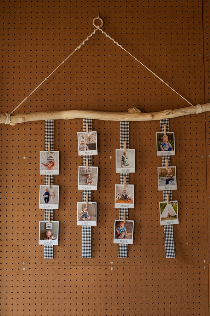 several pictures hanging on a pegboard with clothes pins attached to them and photos pinned to the pegs