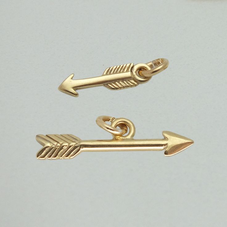 14k Solid Gold Arrow Charm * Easy to add on chains * Great for birthday gifts or anniversary presents! * Details * Vertical Arrow (up and down): 11.5mm x 3mm Horizontal Arrow (left and right): 19mm x 5.3mm Material: 14k Solid Gold This is real 14k solid gold that is made to last! Please note that this listing is for the Charm ONLY. * Checkout more Gold Charm options here: https://etsy.me/3XIffzI Golden Drip 777 is a new Etsy shop offering some steep discounts (with more limited variations) from our many 10+ years here on this platform - enjoy your golden luck, and your new drip. For more jewelry designs, visit our other shop IMJ here: http://etsy.me/1pCPCaL And be sure to view our other shop EMJ here: http://etsy.me/1uLIAIX Visit our "About" page to learn more about our other shops, and th Classic Gold Charms For Anniversary, Classic Yellow Gold Charms For Gifts, Classic Yellow Gold Charms For Gift, Anniversary Presents, Gold Arrow, Arrow Pendant, Heart And Key, Anniversary Present, Gold Charm