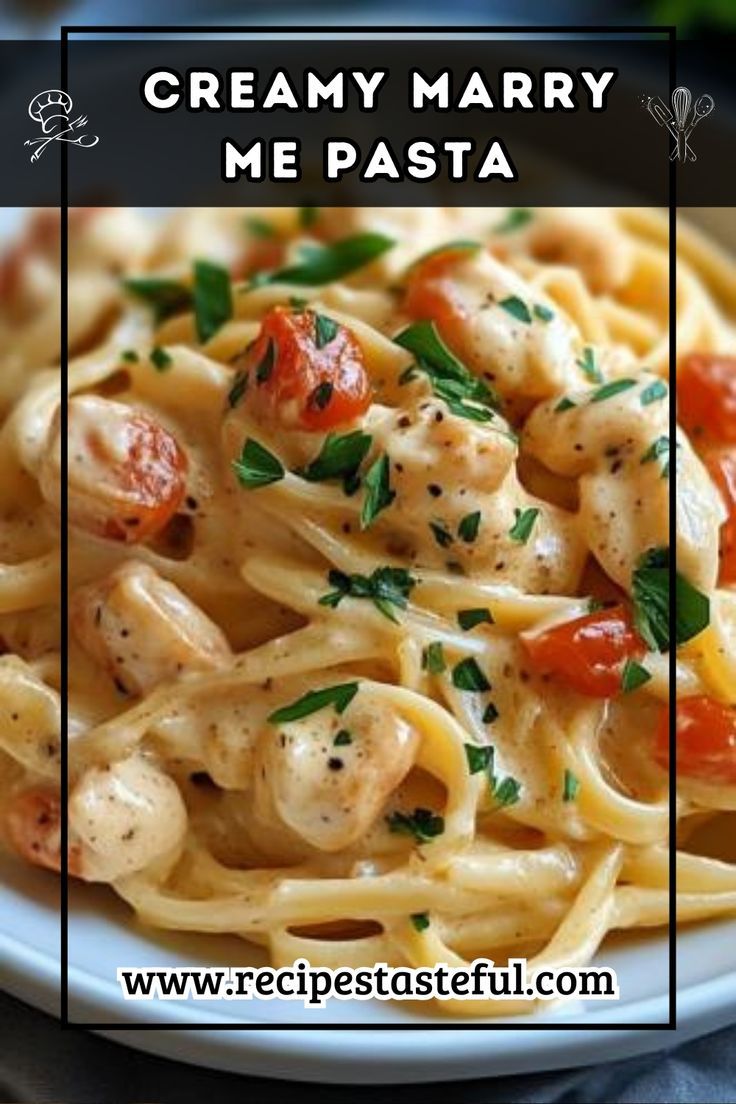 a white plate topped with pasta and shrimp