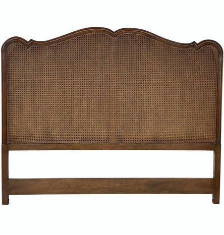 a headboard made out of wicker and wood